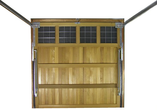 Timber garage door with up and over retractable gear